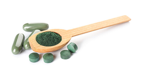 Wooden spoon with spirulina powder and pills isolated on white background