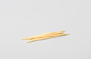 Wooden toothpicks on white background