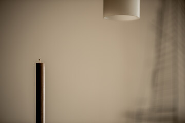 lamp on the wall and candle