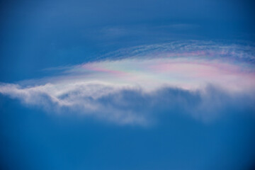 A rainbow lenticular shines above a precipitous cloud buildup over Starkville, Mississippi