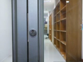 closeup of metal handles with glass door in the office.