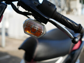 closeup of motorcycle turning light signal.