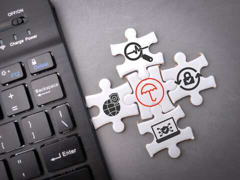 Wireless keyboard and puzzle with Cyber virus with antivirus protection icons.The concept of virtual world security - Powered by Adobe