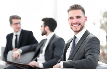 Fototapeta premium smiling businessman in the background of the office.