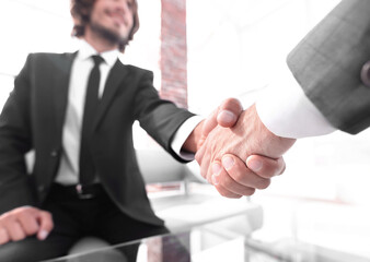 Close-up of two business people shaking hands