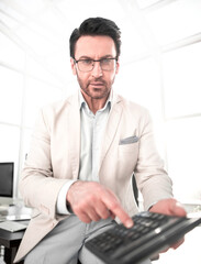 close up. businessman with calculator.