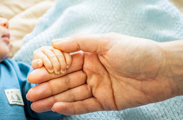 Baby hand and mom pure love