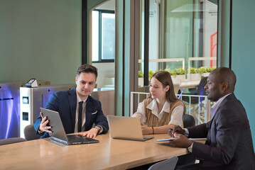 business people or diverse colleagues working and meeting in modern office