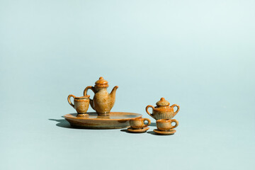 antique ceramic sculpture. art concept on blue background with light and shadow. craft and homemade style.