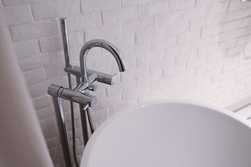 hydrant shower with bathtub in bathroom