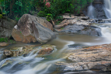 Beautiful Turga waterfall having full streams of water flowing downhill amongst stones , duriing...