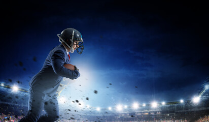 Obraz na płótnie Canvas Businessman acting as american football players