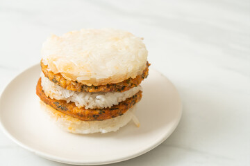 grilled spicy pork and herbs with  sticky rice burger