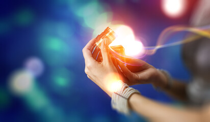 Closeup hands giving surprise gift box