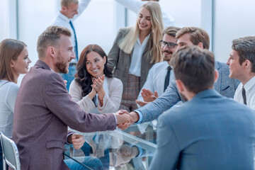 welcome handshake of business people at a meeting in the office