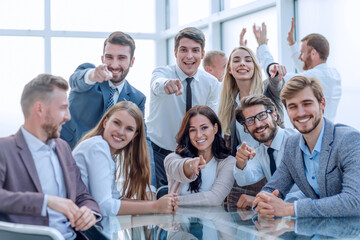 group of young employees are pointing at you