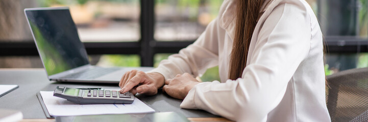 Business concept, Businesswoman calculating cost and profit to analyze about new business project