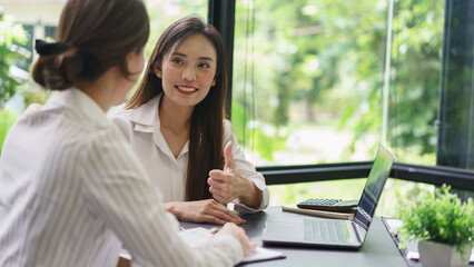 Coworker business concept, Businesswomen make great gesture for colleague after successful project
