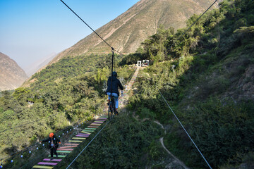 Obraz premium Aerial extreme sport, EXTREME FLYING BIKE, tourist attraction in San Mateo de Otao - Peru.