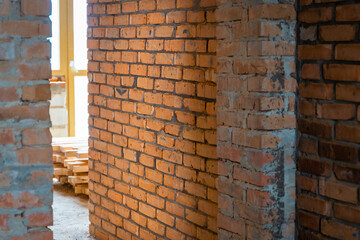 Freshly built red ceramic brick wall in a private house