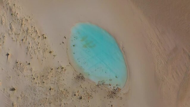 Aerial footage of beautiful crystal clear rain water in white sand, Lancelin, Western Australia