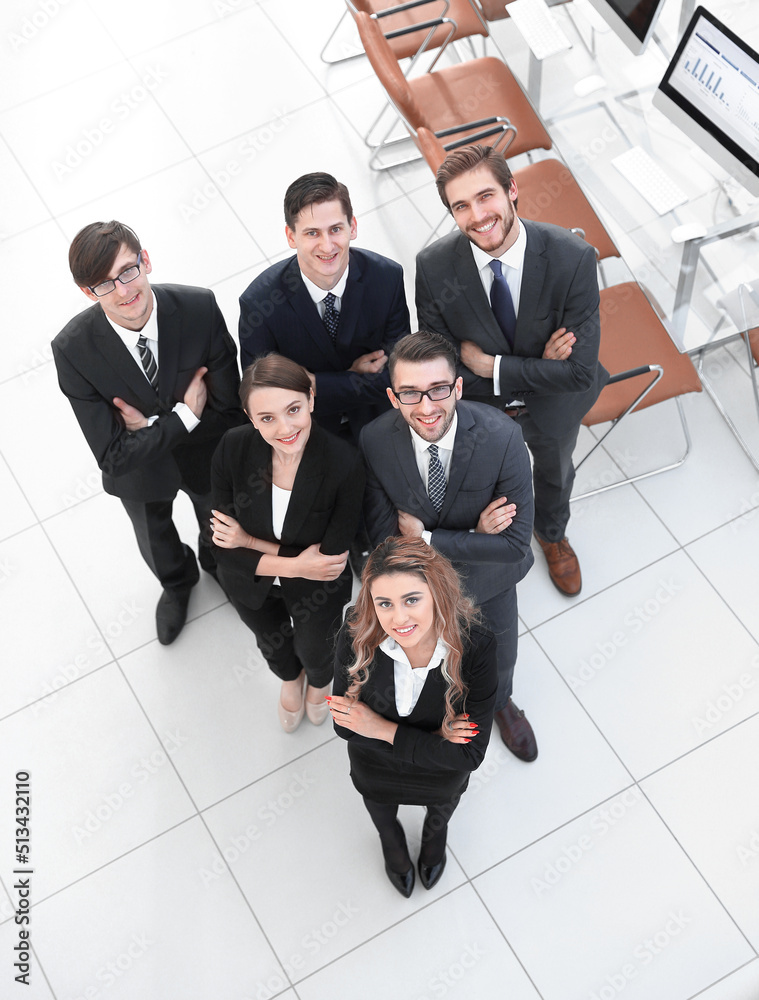 Sticker view from the top .business team standing in office.