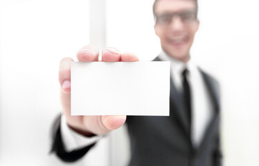 businessman showing a blank business card