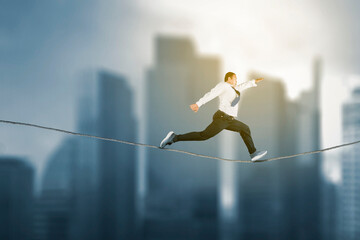 Side view of businessman running fast on the rope