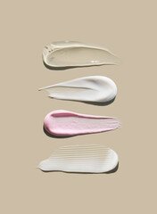 cosmetic smears cream texture on pastel background	
