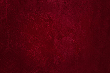 Burgundy colored abstract textured background. Decorative plaster on the wall