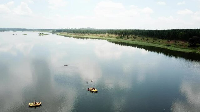 Orbital drone view of rafting boats on the beautiful Nile River in Jinja, Uganda.