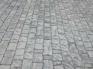Granite cobblestone background. Paving stone texture. Pavement.
