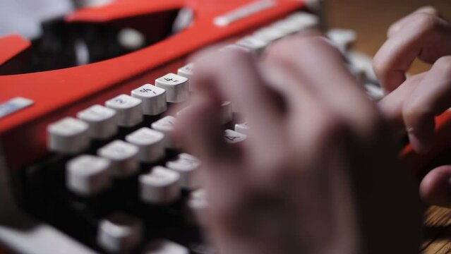 Typing on a typewriter keyboard.