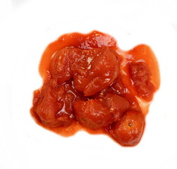 Tinned chopped tomatoes isolated on white background. Tomato sauce, spread with peeled tomato chunk isolated on white 
