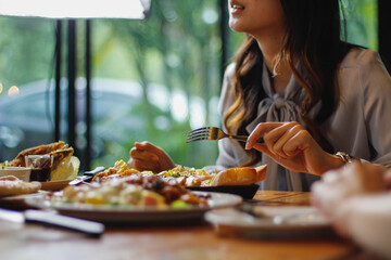 A variety of dishes are laid out on the table to prepare for family and friends banquets during New Year's Eve. Diverse food preparation ideas for family and friends parties during the festive season.