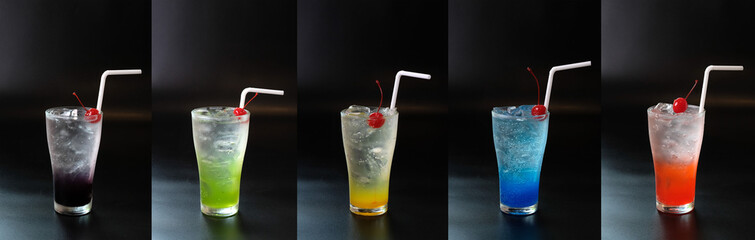Set of fresh summer cocktail with straws and ice cubes. Glass of cocktail soda drink on dark background