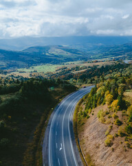 Fototapeta na wymiar aerial view of speedway road in autumn carpathian mountains