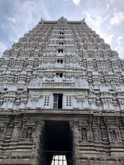 Hindu Shiva temple at Thiruvannamalai in Tamilnadu. Temple tower against blue sky background.