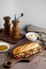 Tasty sandwich with pastrami and mustard on a great background 