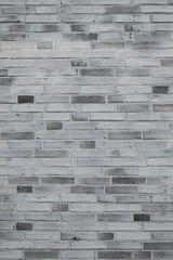 Fototapeta premium White and grey brick wall background, new stones, even structure surface and vertical format
