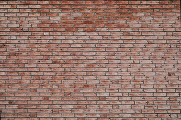 Big red brick wall background with beautiful bricklaying, space for text, no person
