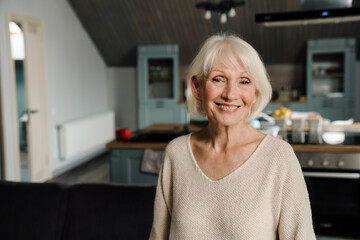 Happy mature woman smiling and looking at camera