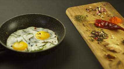 scrambled eggs fried eggs omelet with tomatoes and garlic in a rustic farmhouse style. tasty healthy breakfast