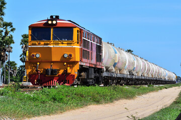 Naklejka premium Thai tanker freight-train by diesel locomotive on the railway.
