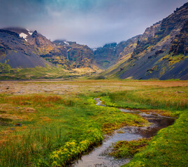 Small creek flowing from great canyon in Iceland. Dramatic summer scene Iceland, Europe. Beauty of...