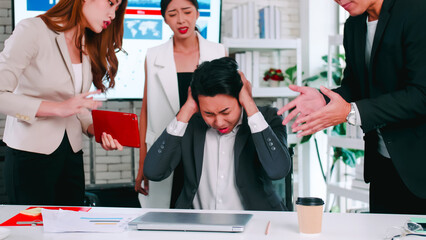 Fototapeta na wymiar Employee having trouble with deadlines on assignments. Businessman is feeling stressed when coworkers rush to finish work.