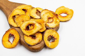 Dried peach slices. Sliced dry peach isolated on white background. Sun-dried fruit. Close up