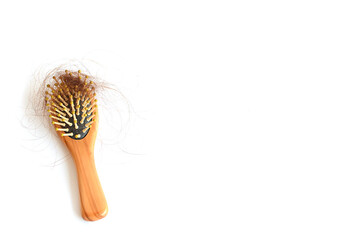 Brown hair, hair loss every day, serious problems and hair loss on a white background.