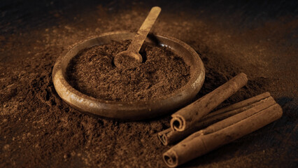 cinnamon ground sticks ceremony cocoa cloves ground coffee spices on wooden table closeup