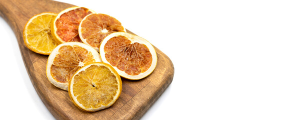 Dried orange slices. Sliced dried orange isolated on a white background. Sun-dried fruit. close up. Copy space